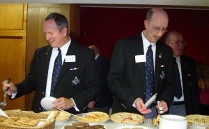 Bro. David & Bro. Tom picking on the fare while Bro. John awaits