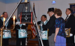 Worshipful Master Alvin Benemerito cementing the stone