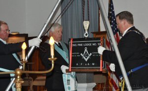 WBro Joe McBride as Grand Junior Warden testing the stone with the Plumb