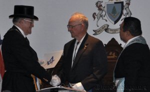 GM Parsons congratulating WBro. Mauch